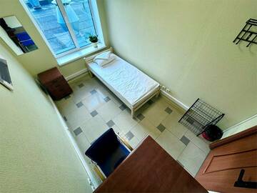 Кровать в общем номере для мужчин с 4 кроватями в Хостеле Невский